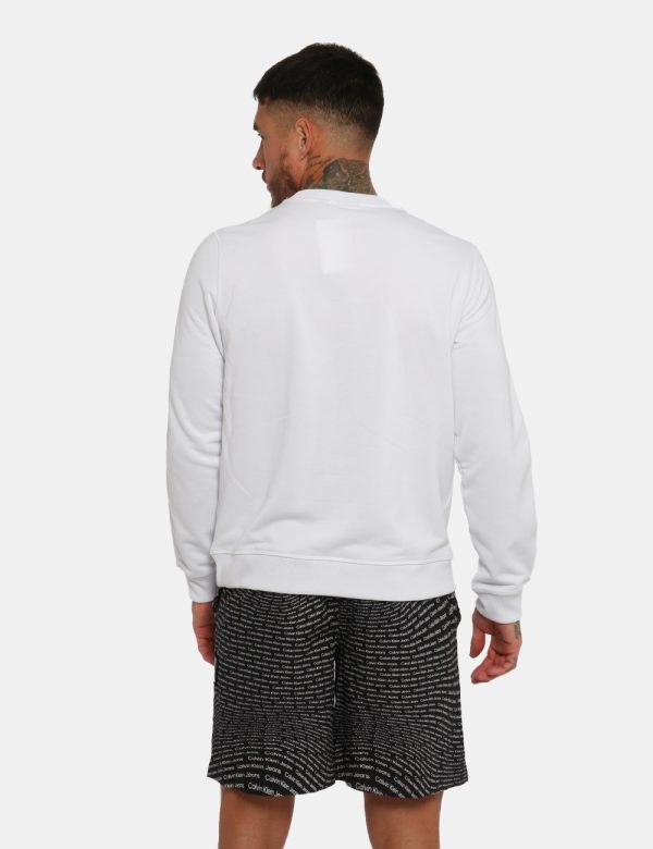 Felpa Calvin Klein Bianco - Felpa con girocollo classico in total bianco. Presenti stripes sulla maniche con logo brand. La