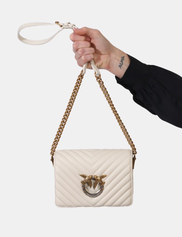 Borsa Pinko Bianco - Borsa modello simil pochette in total bianco panna con logo brand in metallo dorato e argentato. L'inte