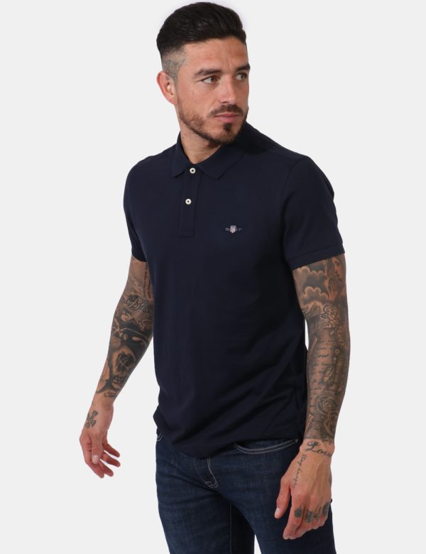 Polo Gant Blu - Polo a maniche corte in total blu navy con patch logo brand ricamato ad altezza cuore. Presente colletto all