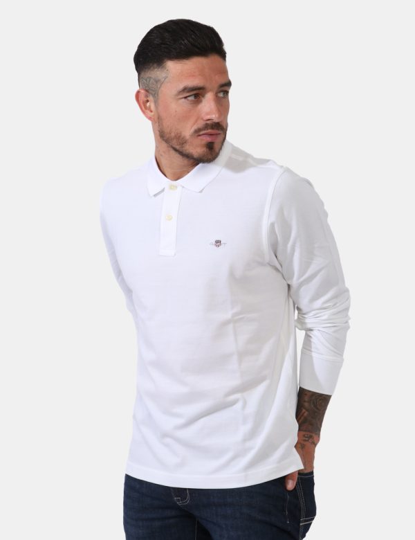 Polo Gant Bianco - Polo a maniche lunghe in total bianco con patch logo brand applicato ad altezza cuore. Presente colletto