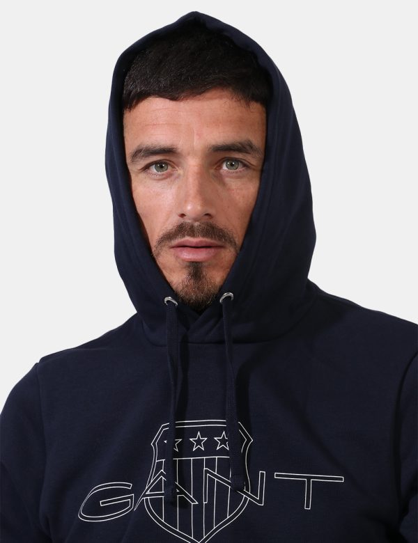Felpa Gant Blu - Felpa con cappuccio in total blu navy con logo brand sul fronte. La vestibilità è morbida e regolare. La fe