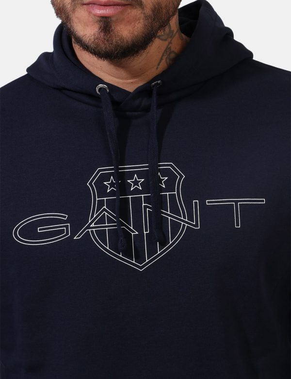 Felpa Gant Blu - Felpa con cappuccio in total blu navy con logo brand sul fronte. La vestibilità è morbida e regolare. La fe