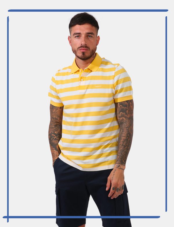 Polo Gant Giallo - Polo in fantasia rigata bianco e giallo limone con logo brand ricamato ad altezza cuore. Presente collett