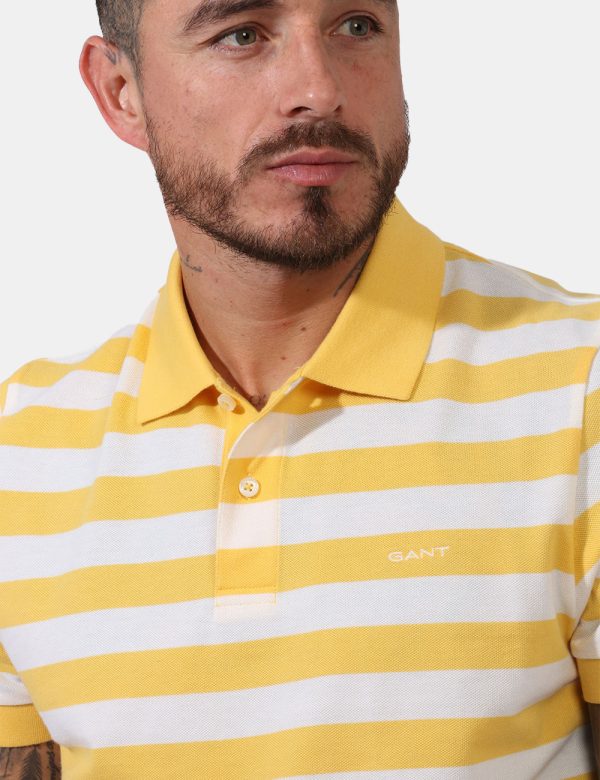 Polo Gant Giallo - Polo in fantasia rigata bianco e giallo limone con logo brand ricamato ad altezza cuore. Presente collett
