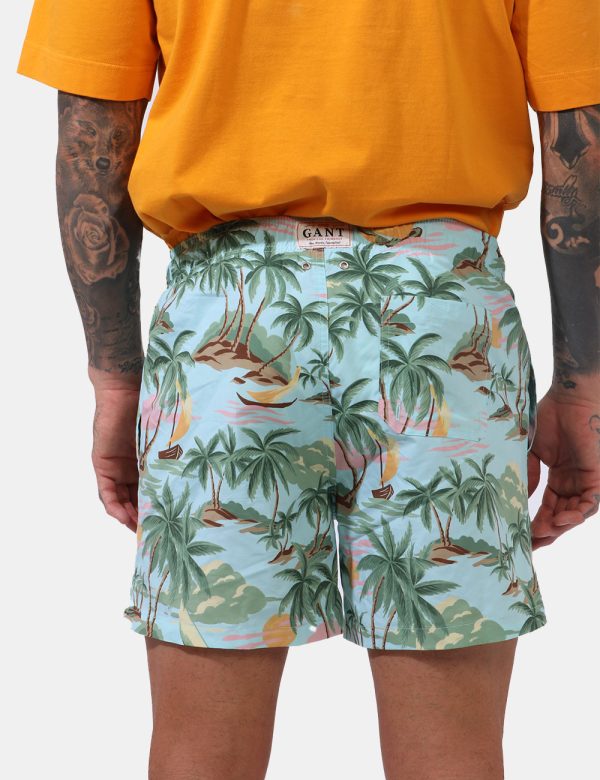 Costume Gant Azzurro - Costume su base azzurro acquamarina con stampa allover palme e tramonti in tinta coordinata. Presenti