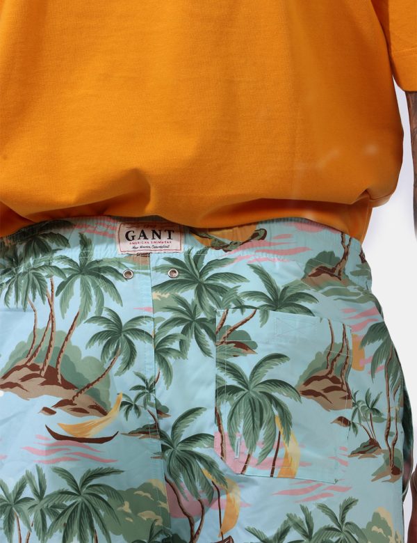 Costume Gant Azzurro - Costume su base azzurro acquamarina con stampa allover palme e tramonti in tinta coordinata. Presenti