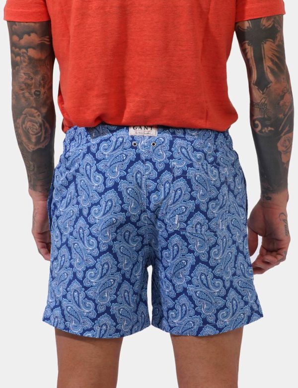 Costume Gant Azzurro - Costume su base azzurro/blu con stampa allover mare in tinta coordinata. Presenti tasche a taglio tra