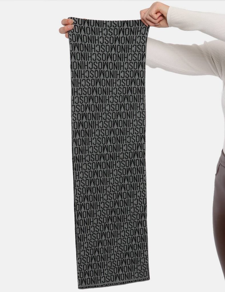 Sciarpa Moschino nero/grigio - COMPOSIZIONE E VESTIBILITÀ:100% lanaCONSIGLI DI STILE:Sciarpa in lana su base nera e grigia c