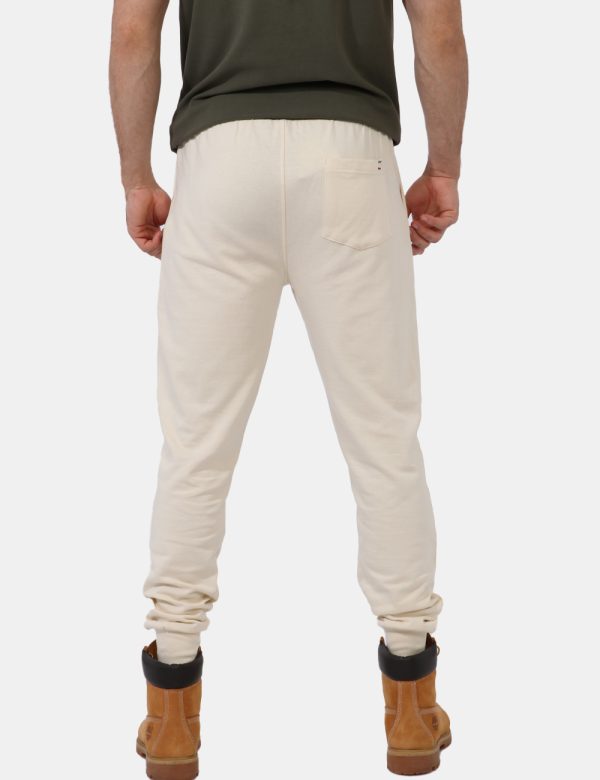 Pantaloni Aeronautica Italiana Bianco - Pantaloni simil tuta in total bianco latte con polsino sul girocaviglia. Presenti ta