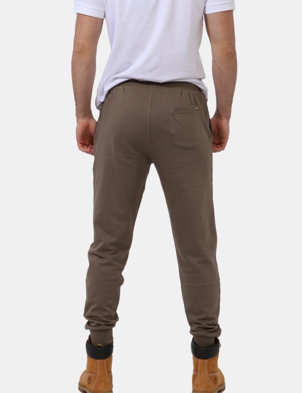 Pantaloni Aeronautica Italiana Marrone - Pantaloni simil tuta in total verde tabacco con polsino sul girocaviglia. Presenti