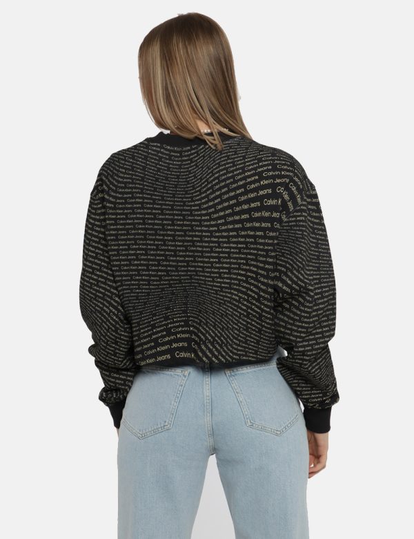 Felpa Calvin Klein Nero - Felpa corta con girocollo classico su base nera con stampa allover logo brand dorato. La vestibili