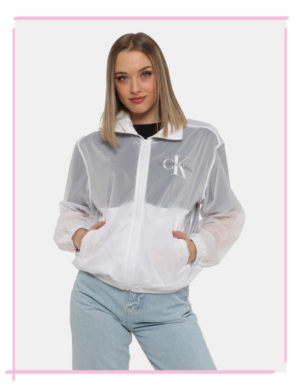 Giacca Calvin Klein Bianco - Giacca leggera simil kway con cappuccio ed in total bianco. Presenti tasche a taglio trasversal