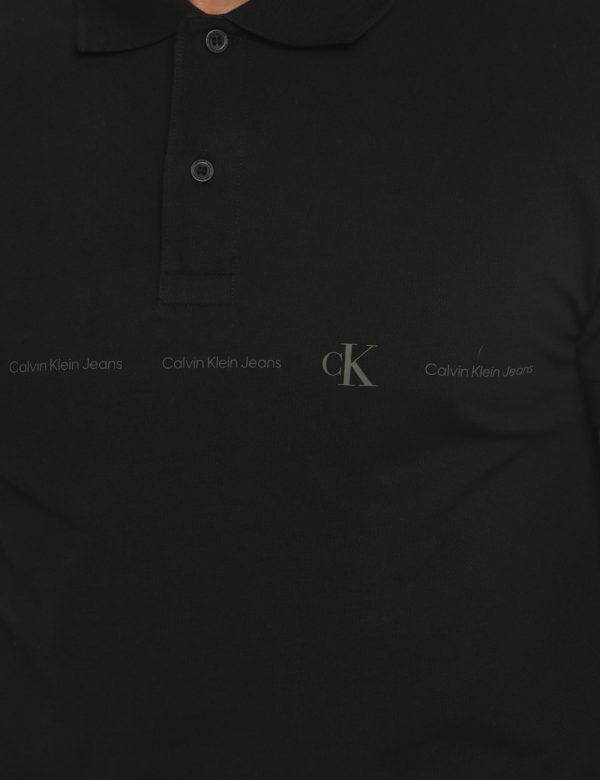 Polo Calvin Klein Nero - Polo in total nero slavato con logo brand stampato in grigio. Presente colletto alla peter pan in t