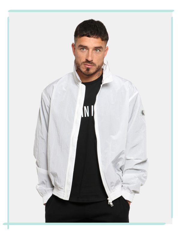 Giacca Calvin Klein Bianco - Giacca simil kway leggero in total bianco con interno traforato nero. Presenti tasche a taglio