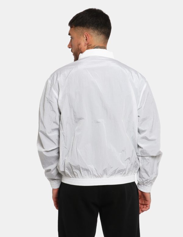 Giacca Calvin Klein Bianco - Giacca simil kway leggero in total bianco con interno traforato nero. Presenti tasche a taglio