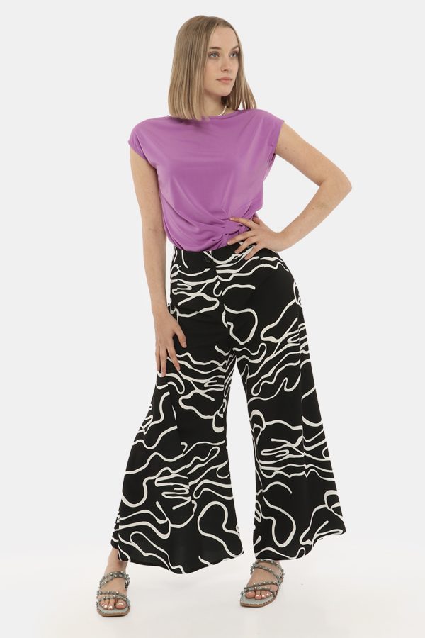 Pantalone Vougue bianco e nero - COMPOSIZIONE E VESTIBILITÀ:97% poliestere 3% elastaneLa modella è alta 170 cm e indossa la