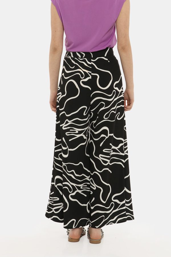 Pantalone Vougue bianco e nero - COMPOSIZIONE E VESTIBILITÀ:97% poliestere 3% elastaneLa modella è alta 170 cm e indossa la