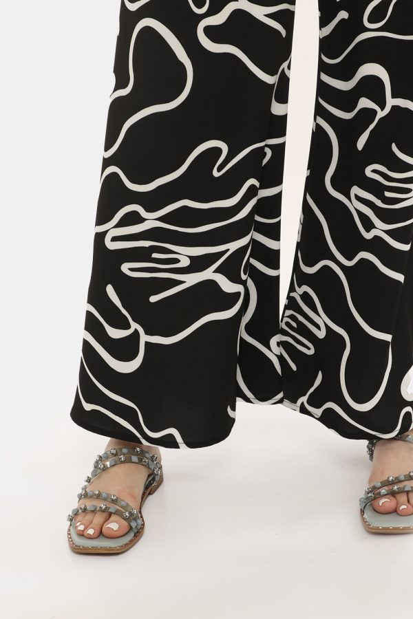 Pantalone Vougue bianco e nero - COMPOSIZIONE E VESTIBILITÀ:97% poliestere 3% elastaneLa modella è alta 170 cm e indossa la