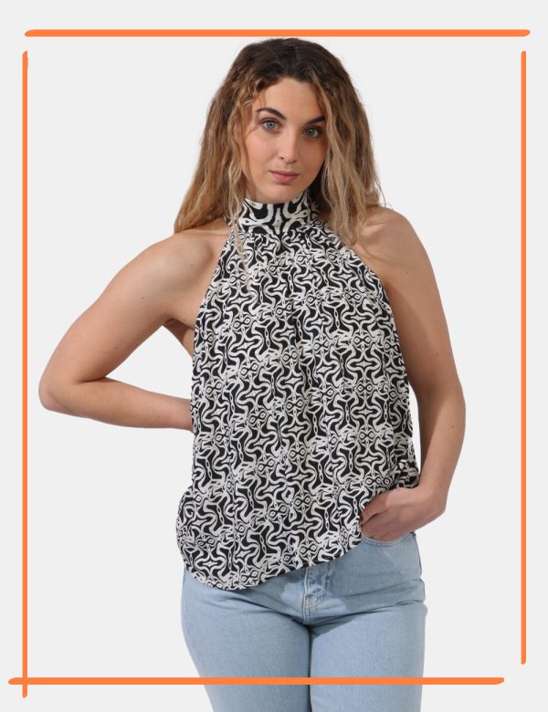 Top Desigual Bianco - Top smanicato morbido in fantasia bianco e nero. Il . Il capo ha l'allacciatura sul girocollo ed è ada