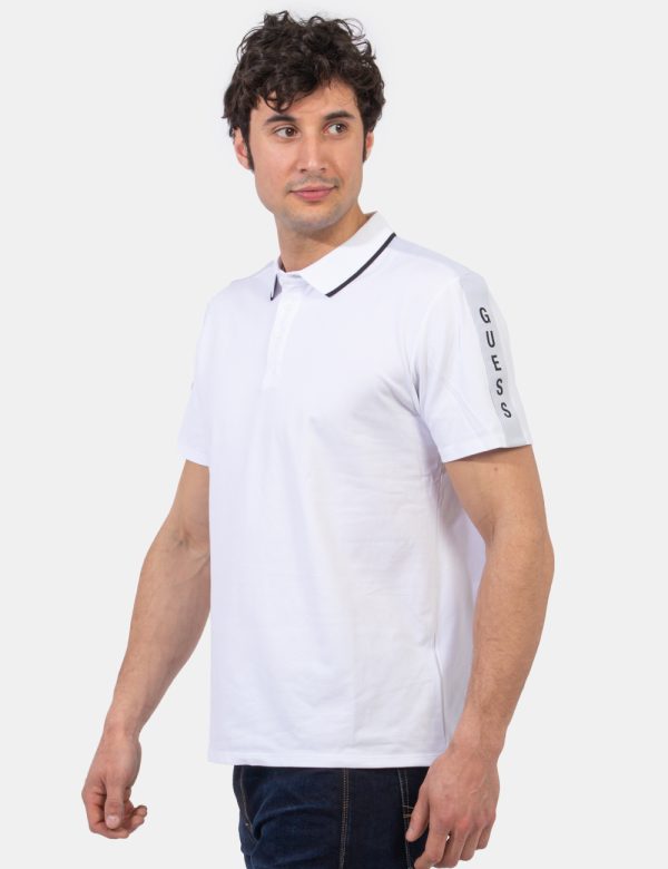 Polo Guess Bianco - Polo classica in total bianco con stripes logo brand su manica sinistra più profilo nero sul colletto al
