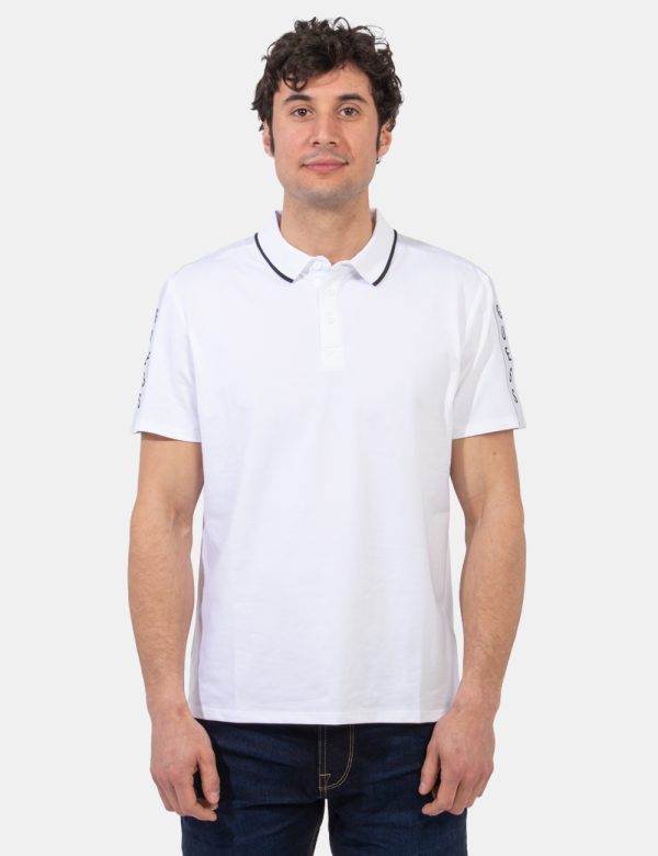 Polo Guess Bianco - Polo classica in total bianco con stripes logo brand su manica sinistra più profilo nero sul colletto al