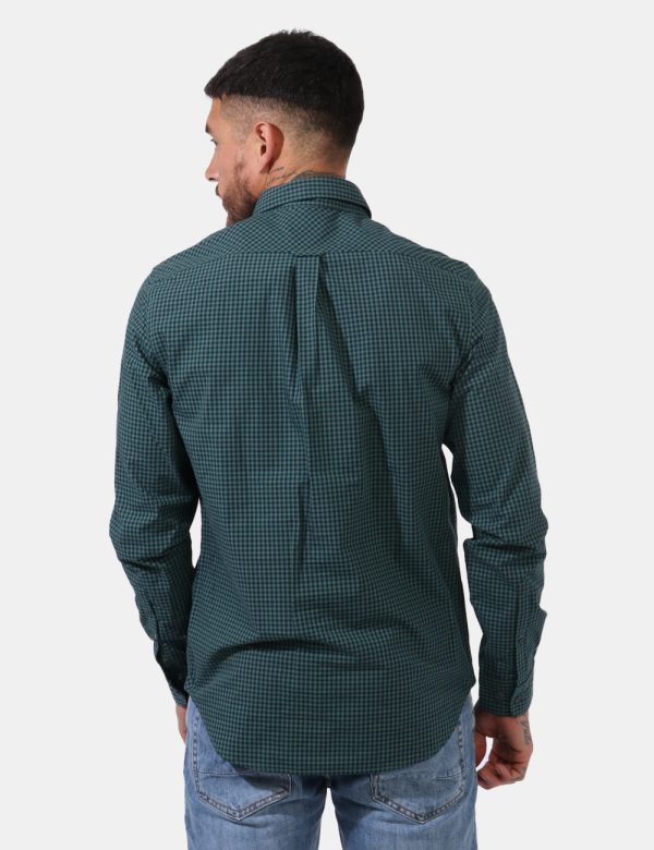 Camicia Timberland Verde - Camicia classica in fantasia quadrettata nera e verde. Presente logo brand ricamato ad altezza cu