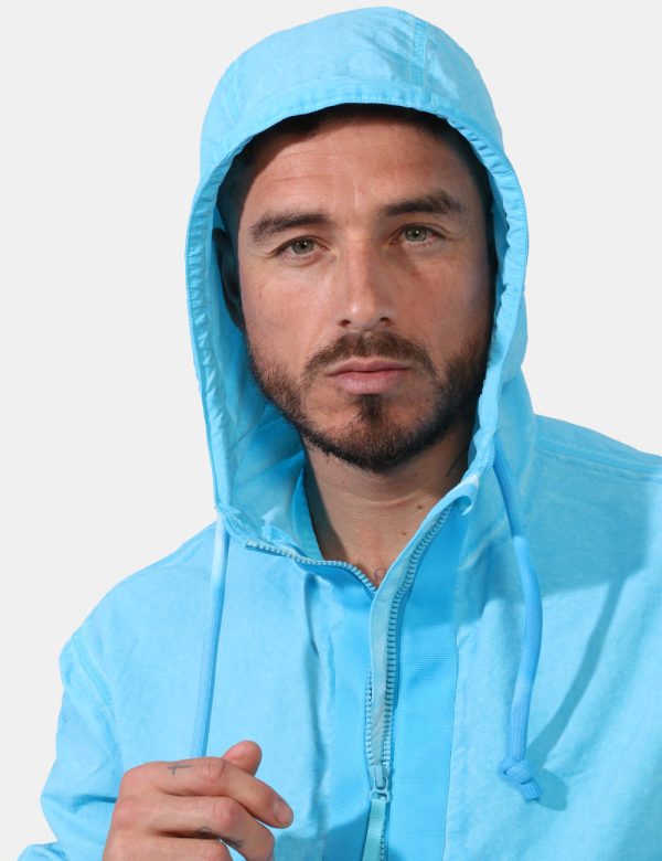 Giacca Timberland Azzurro - Giacca simil felpa con cappuccio in total azzurro intenso. Presenti tasche a taglio trasversale