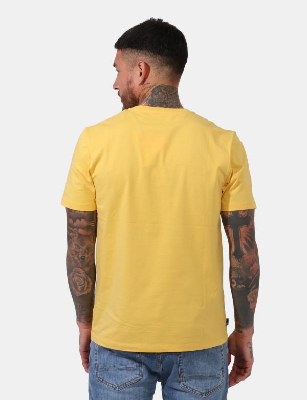 T-shirt Timberland Giallo - T-shirt su sfondo giallo intenso con ampia stampa logo brand in tinta coordinata. La vestibilità