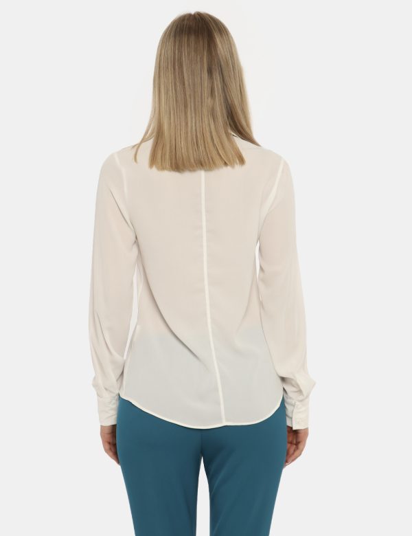 Camicia Vougue bianco - COMPOSIZIONE E VESTIBILITÀ:100% poliestereLa modella è alta 176 cm e indossa la taglia S. La vestibi