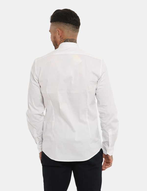 Camicia Antony Morato classica bianca - COMPOSIZIONE E VESTIBILITÀ:76% cotone 21% poliamide 3% elastaneIl modello è alto 178