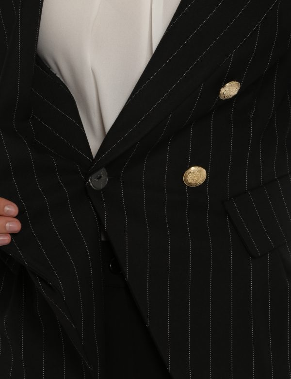 Giacca Vougue nero gessato - COMPOSIZIONE E VESTIBILITÀ:63% poliestere 34% viscosa 3% elastaneLa modella è alta 176 cm e ind