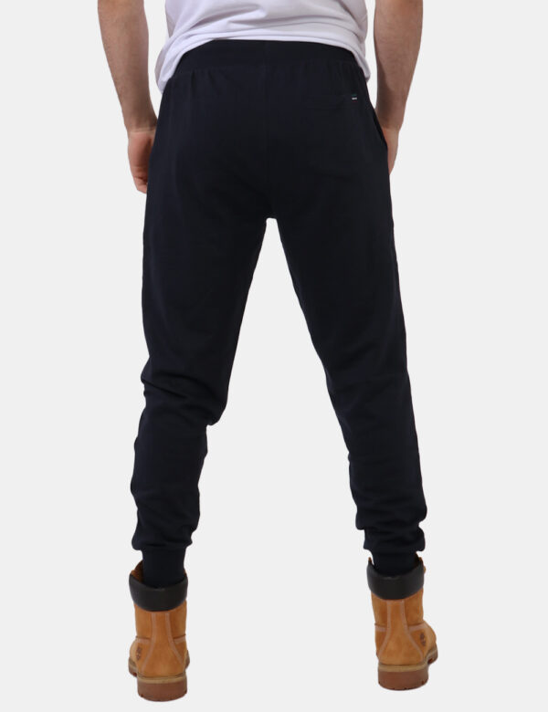 Pantaloni Aeronautica Italiana Blu - Pantaloni tuta in total blu navy con logo brand ricamato in tonalità originale. Present