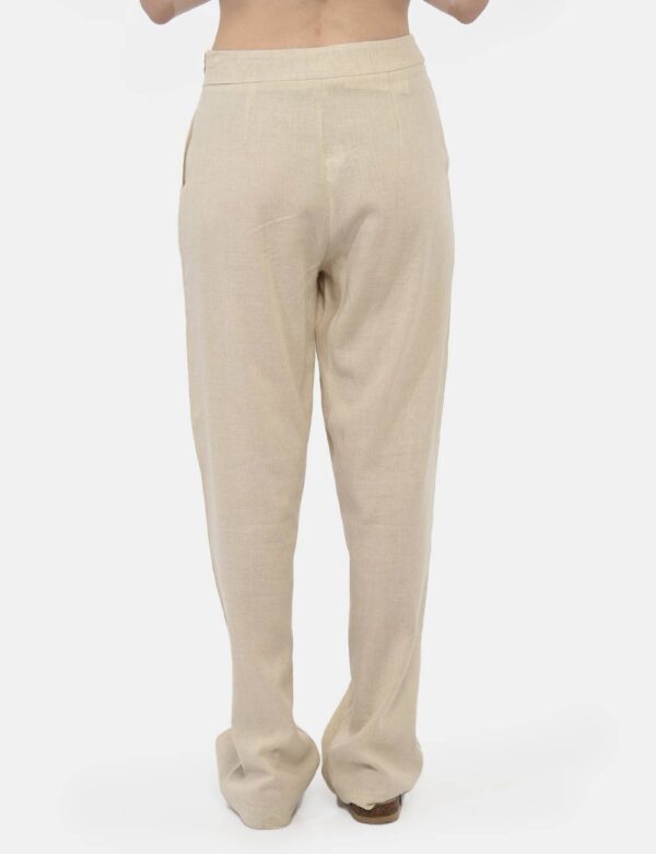Pantaloni Rue De Clerie Beige - Pantaloni larghi in total beige con tasche a taglio trasversale. La vestibilità è morbida e