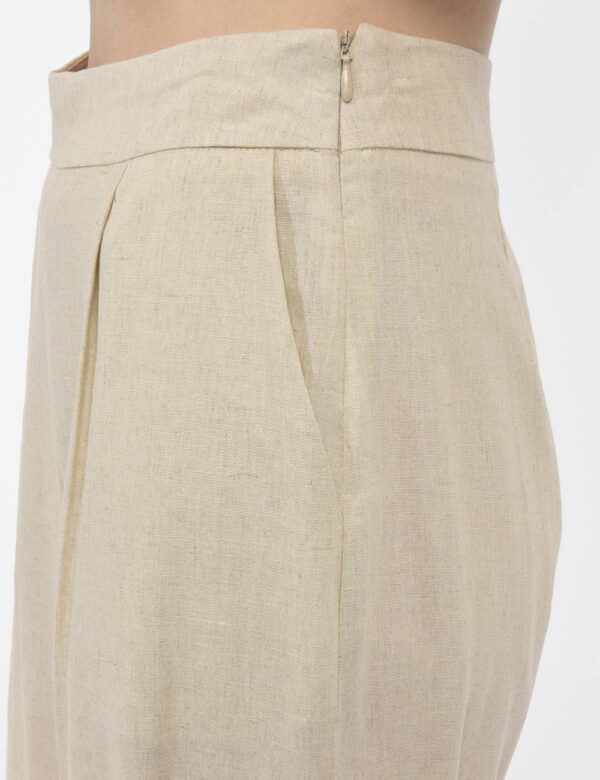 Pantaloni Rue De Clerie Beige - Pantaloni larghi in total beige con tasche a taglio trasversale. La vestibilità è morbida e
