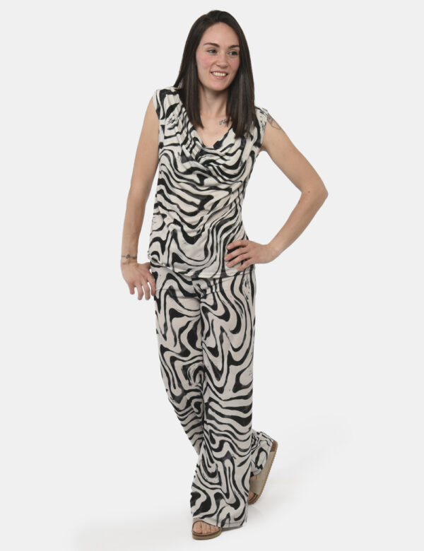 Pantaloni Rue De Clerie Nero - Pantaloni eleganti e larghi su base beige con fantasia nera. La vestibilità è pratica e regol