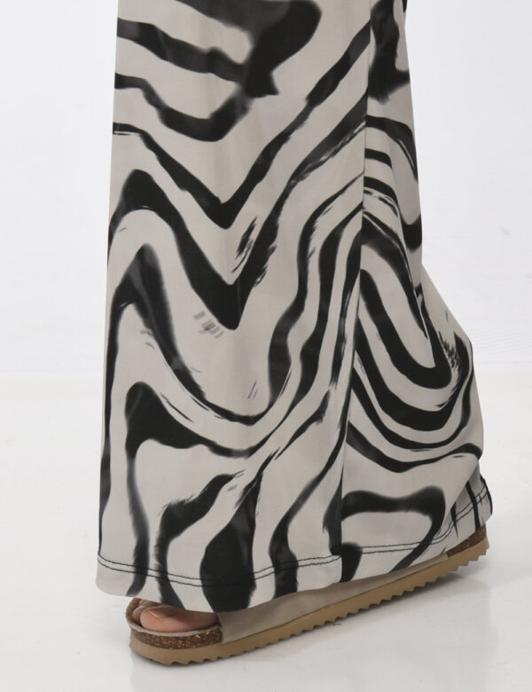 Pantaloni Rue De Clerie Nero - Pantaloni eleganti e larghi su base beige con fantasia nera. La vestibilità è pratica e regol