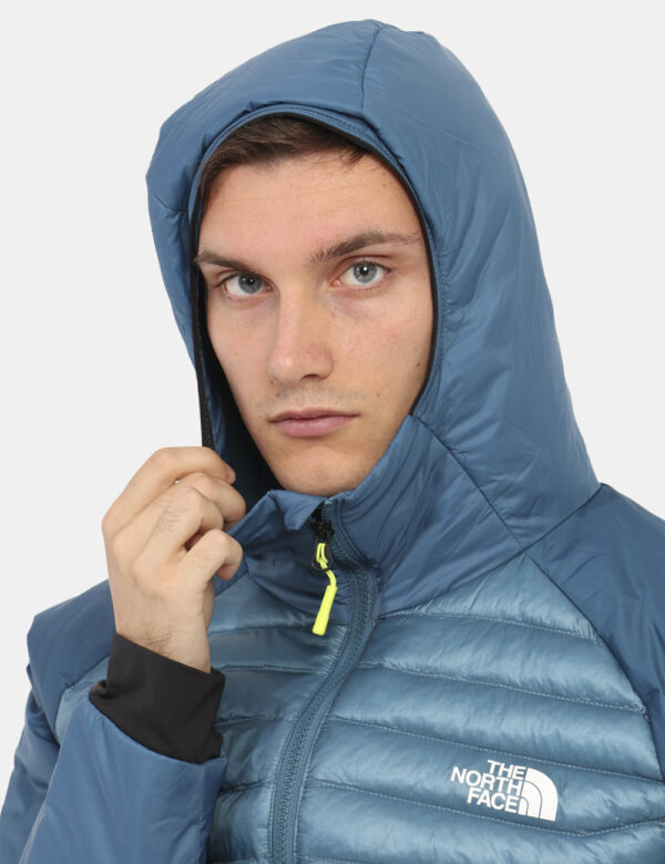 Piumino The North Face Blu - Piumino 100 grammi con cappuccio e tasche. Indossalo per le tue passeggiate outdoor o in città