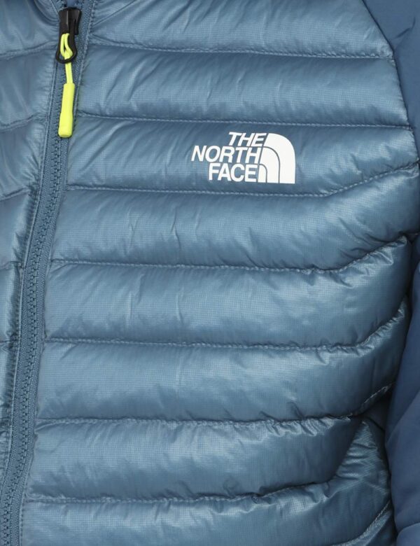 Piumino The North Face Blu - Piumino 100 grammi con cappuccio e tasche. Indossalo per le tue passeggiate outdoor o in città