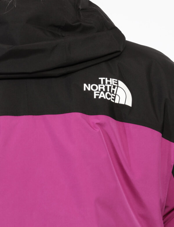 Piumino The North Face Fucsia - Piumino iconico The North Face bicolore esternamente, fucsia e nero, e internamente bordeaux