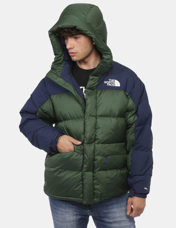 Piumino The North Face Verde - Piumino bicolor blu navy e verde foresta con cappuccio interno. Presenti tasche a taglio tras