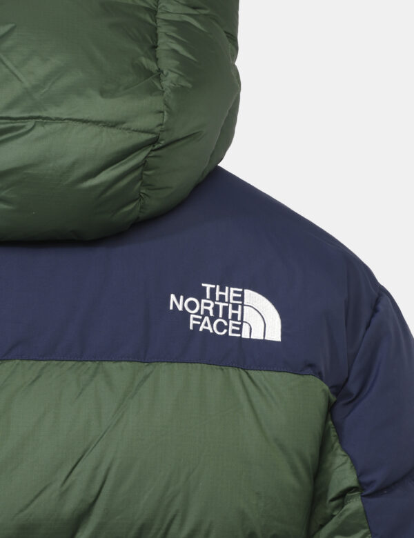 Piumino The North Face Verde - Piumino bicolor blu navy e verde foresta con cappuccio interno. Presenti tasche a taglio tras