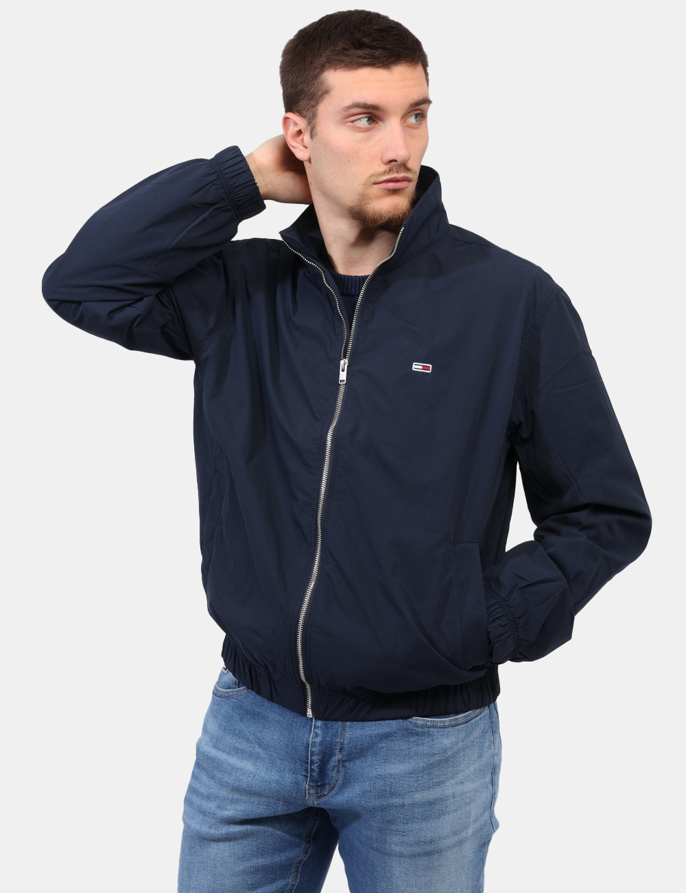 Giubbino Tommy Hilfiger Blu - Giacca impermeabile in total blu navy con tasche a taglio trasversale e chiusura a bottone. La