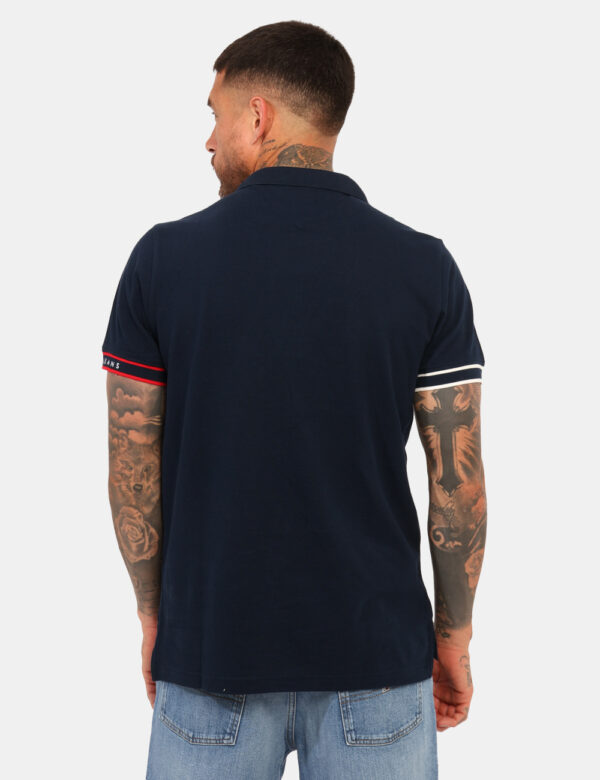 Polo Tommy Hilfiger Blu - Polo classica in total blu con logo ricamato ad altezza cuore in blu e rosso richiamato nel profil