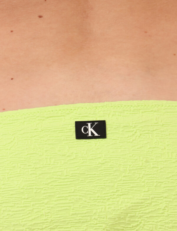 Costume slip Calvin Klein Verde - Costume un solo pezzo slip, in total verde fluo con laccetti laterali che rendono la vesti