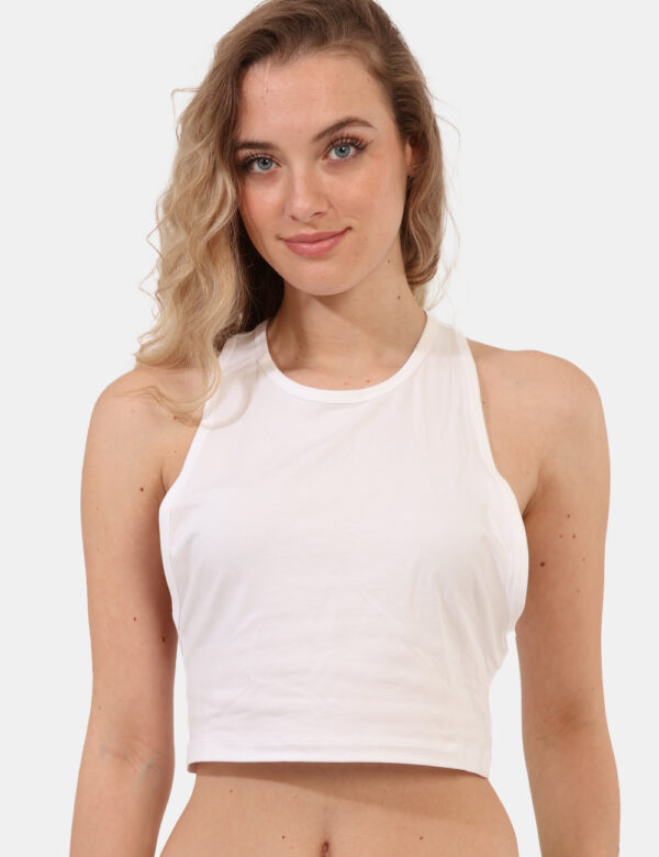 Top Calvin Klein Bianco - Top corto in total bianco, scollato sulla schiena con fascia brandizzata ed elasticata. La vestibi