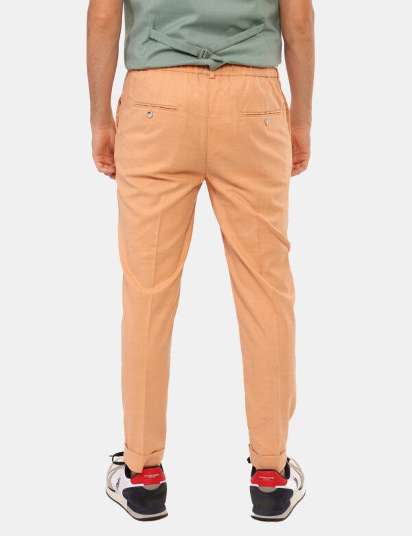 Pantaloni Sseinse Arancione - Pantaloni in total arancione con tasche a taglio trasversale e tasche a fessura sul retro con