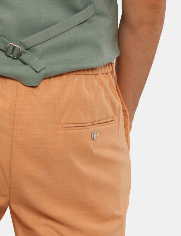 Pantaloni Sseinse Arancione - Pantaloni in total arancione con tasche a taglio trasversale e tasche a fessura sul retro con