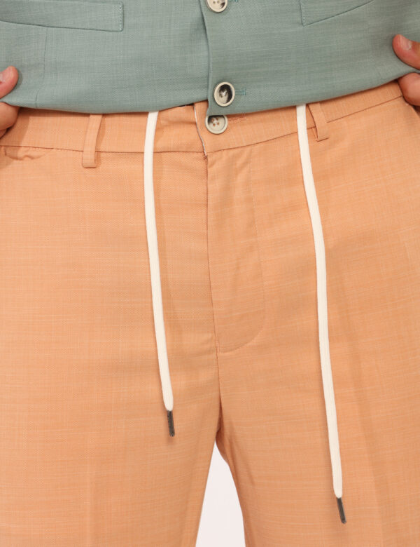 Pantaloni Sseinse Arancione - Pantaloni in total arancione con tasche a taglio trasversale e tasche a fessura sul retro con