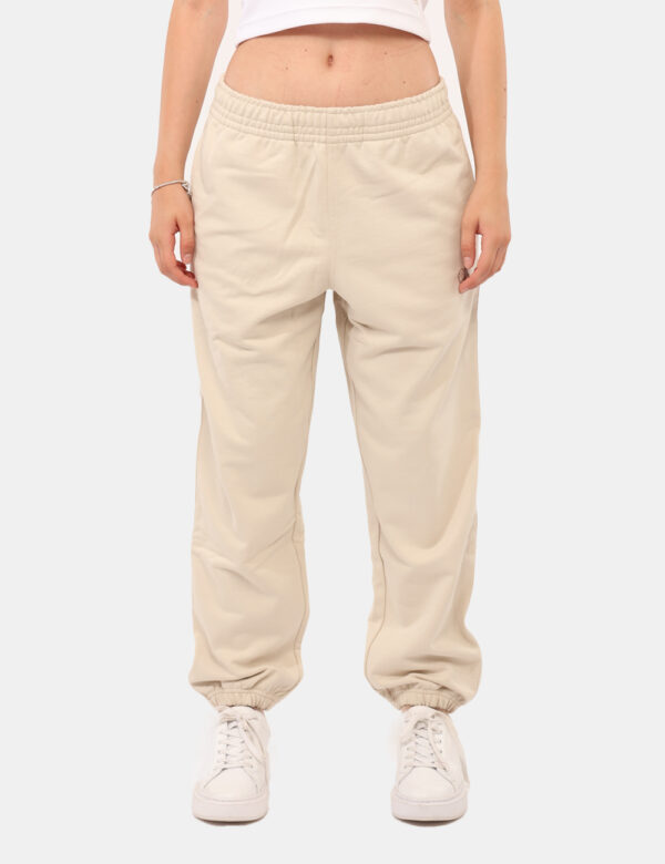 Pantaloni Calvin Klein Beige - Pantaloni tuta in total beige, con logo brand ricamato bianco e tasche a taglio trasversale.