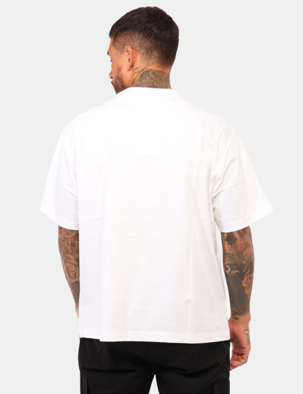 T-shirt Calvin Klein Bianco - T-shirt classica in total bianco con stampa logo brand nero. La vestibilità è morbida e regola